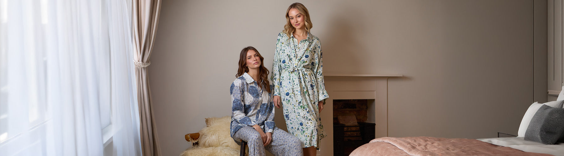 Models are wearing the Corina robe in pressed floral blue print and Evie PJ in blue aster patchwork print - desktop version