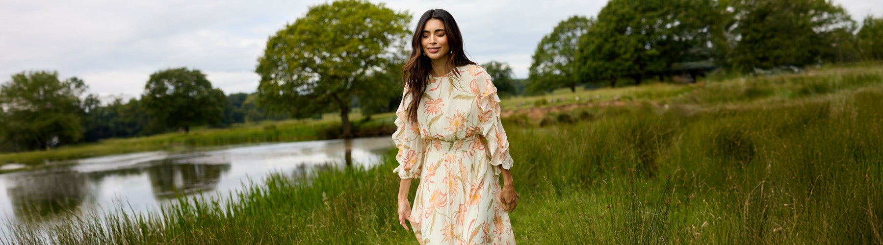 Mia Moonflower Cream Midi Dress with a gathered waist and cowl back detail.